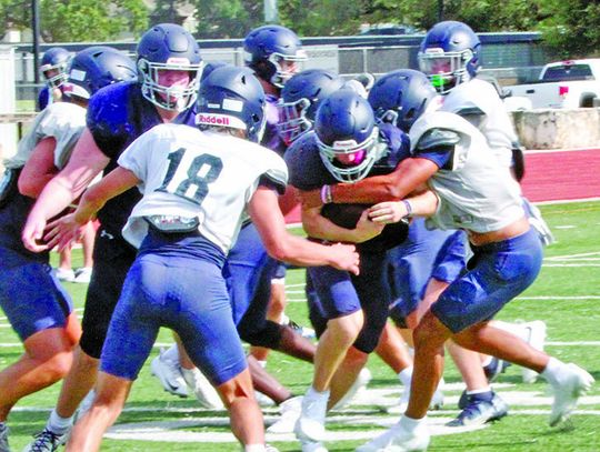 Area football teams in intrasquad scrimmages