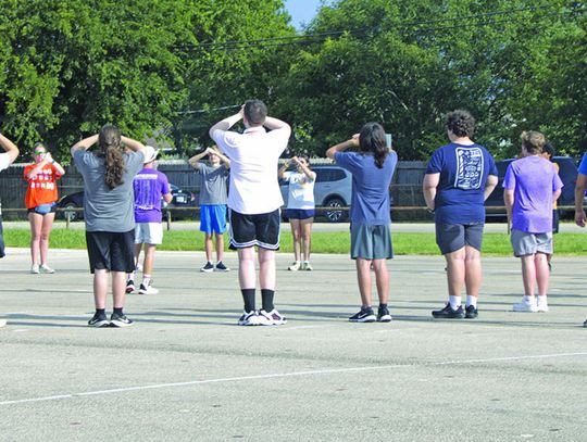 Bands open marching season in heat of summer