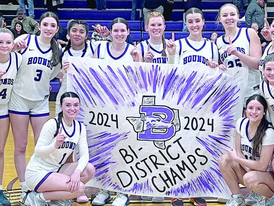 Members of the Boerne High girls basketball team celebrate Tuesday’s first-round playoff win over Gonzales before the home crowd. Star photo by Kerry Barboza