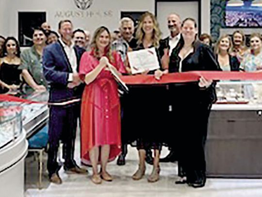 Chamber cuts ribbon with August House Jewelry