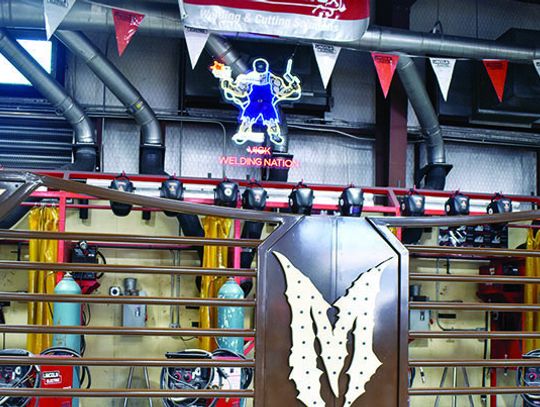 Champion welding presents custom-made gate to Martin Bros.