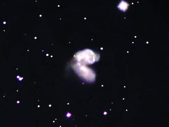 Colliding galaxies part of July night sky