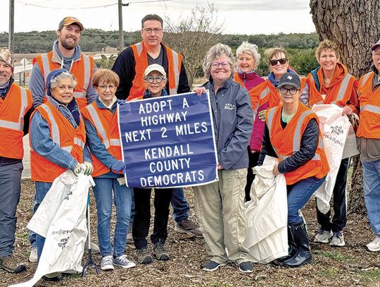 County Democrats clean stretch of roadway