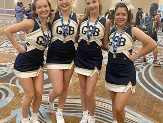 Geneva cheer members at UCA camp in August