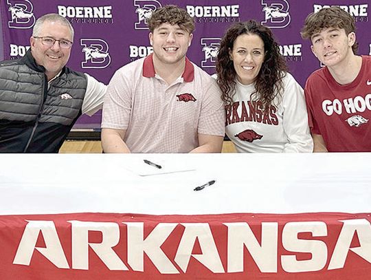 Hendrix signs to play football at the University of Arkansas