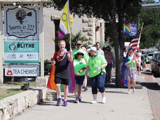 Hundreds take pride in walk down Main