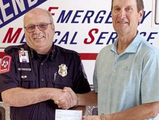 Tapatio Springs MGA presents check to Kendall County EMS