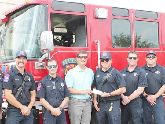 Tapatio Springs presents check to Boerne Fire Department