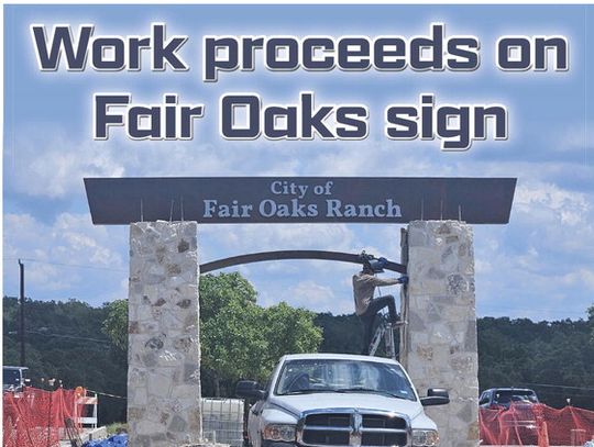 Work proceeds on the Fair Oaks sign