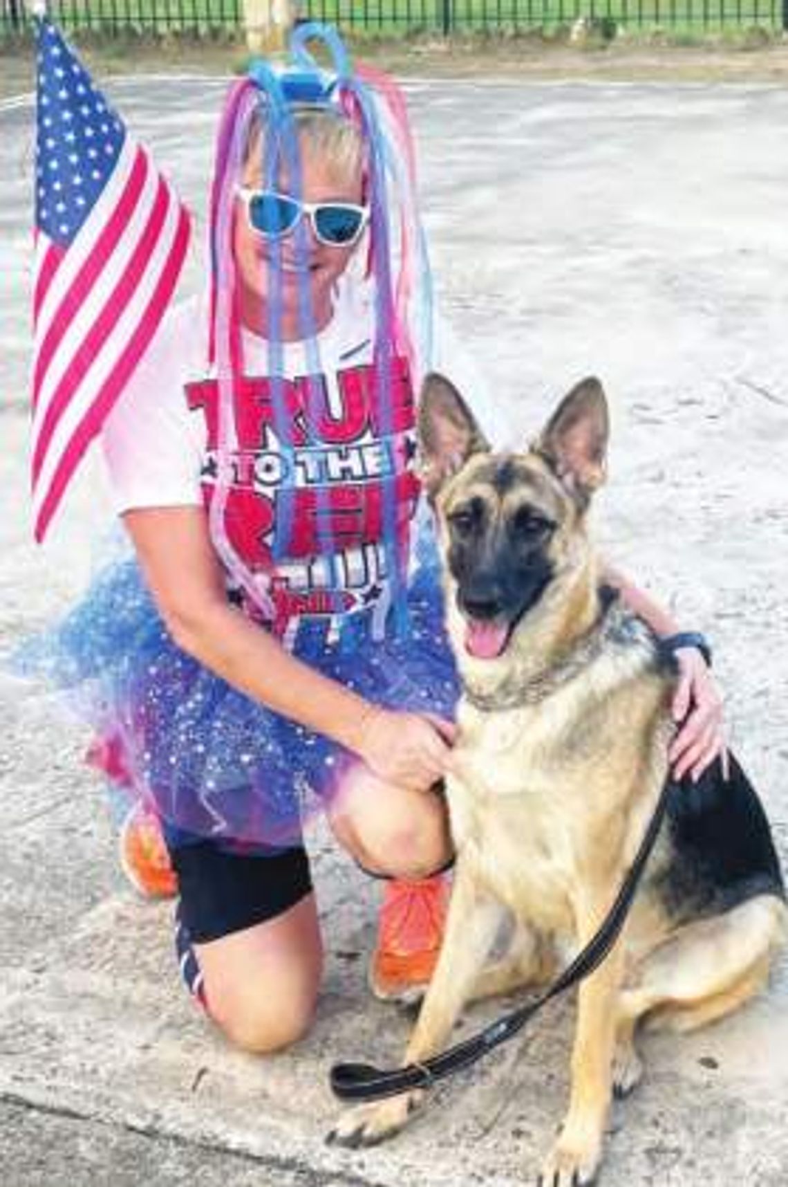 A red, white and blue jog with a dog celebration