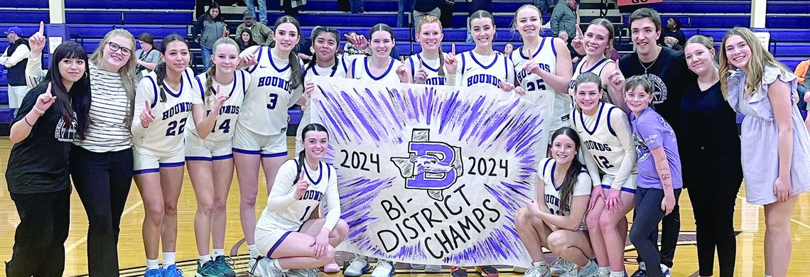 Members of the Boerne High girls basketball team celebrate Tuesday’s first-round playoff win over Gonzales before the home crowd. Star photo by Kerry Barboza
