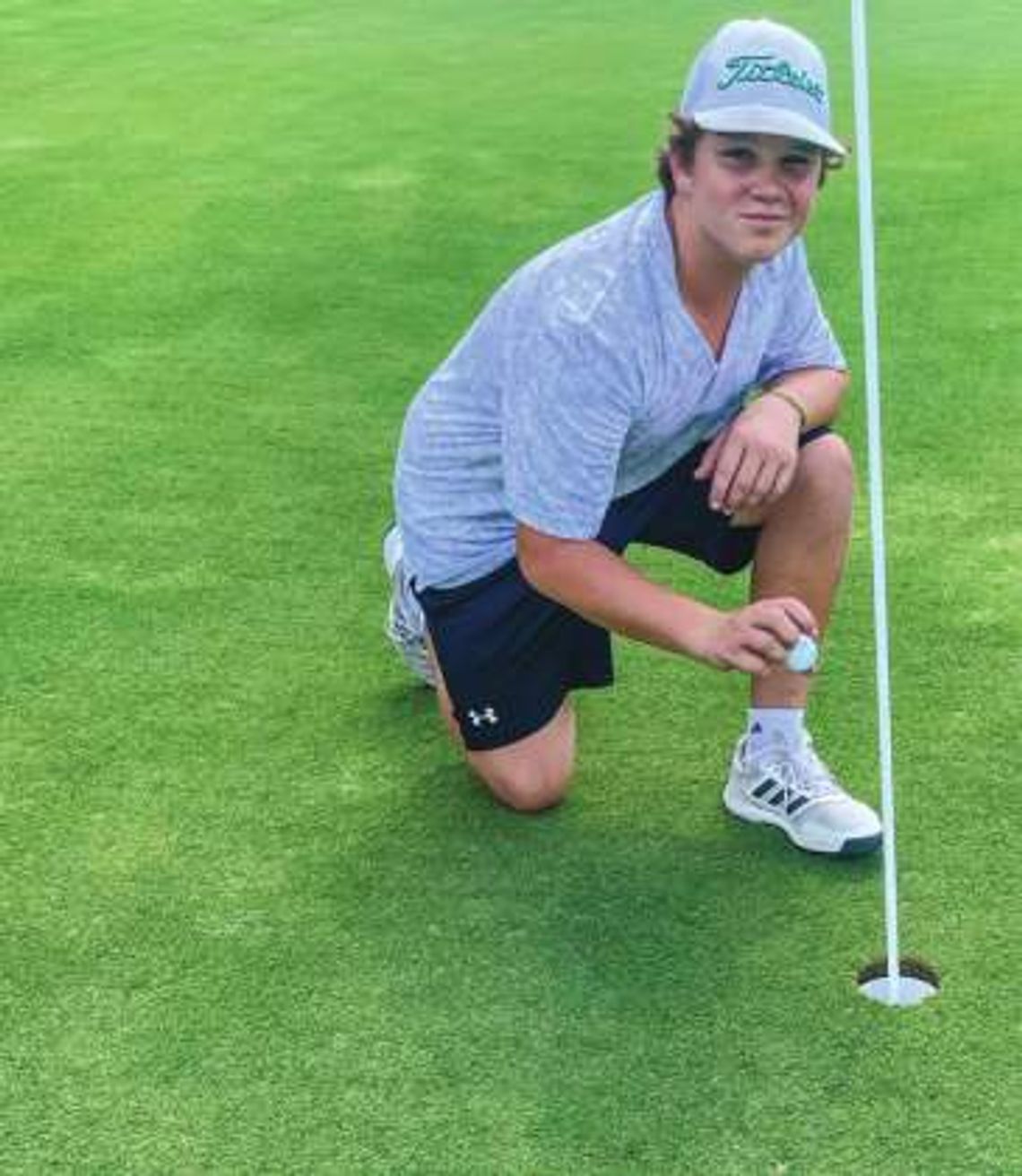 Carson Clark cards hole in one