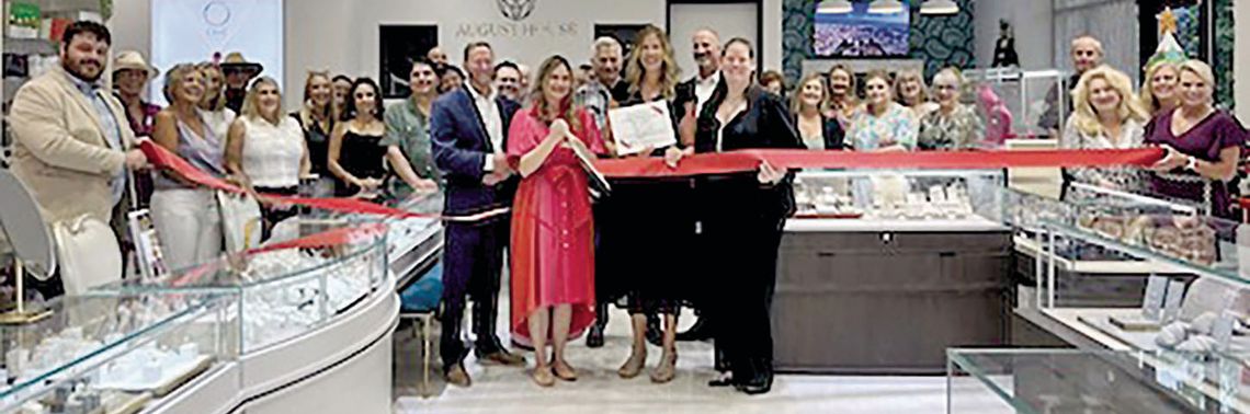 Chamber cuts ribbon with August House Jewelry