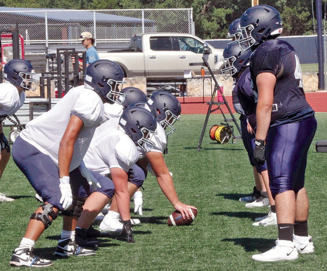 Chargers begin football workouts