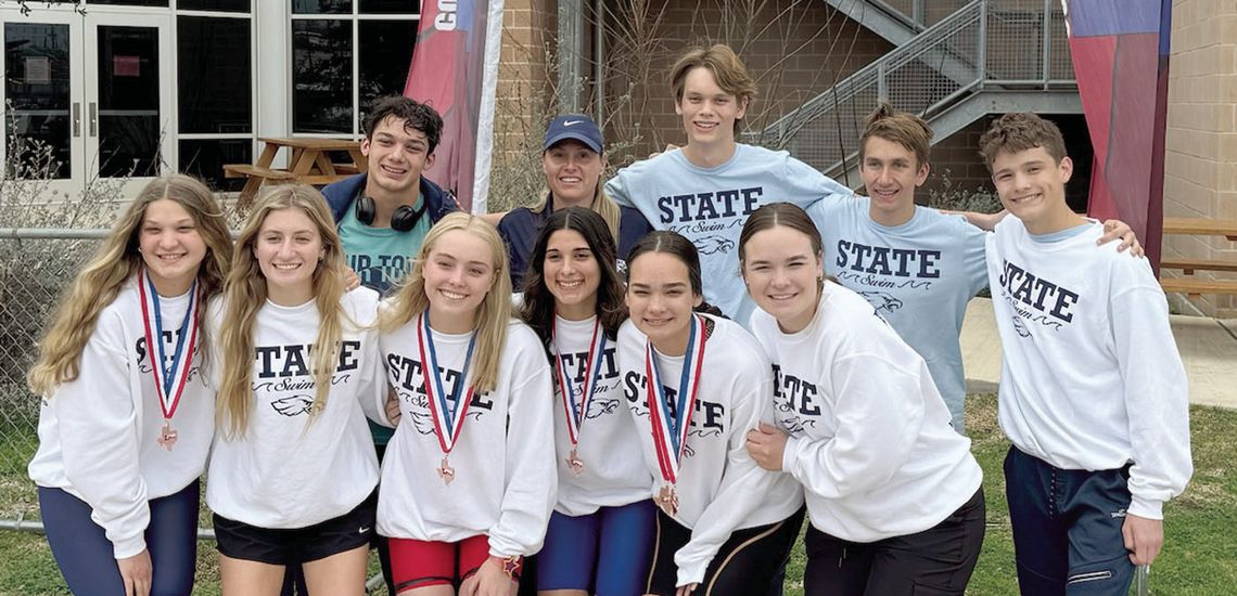 The Geneva swim team competed at the TAPPS state meet and earned a few medals. The swimmers pose for a photo at the meet. Submitted photo