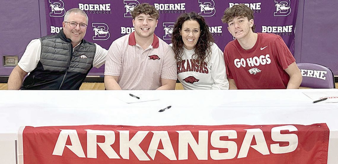 Hendrix signs to play football at the University of Arkansas