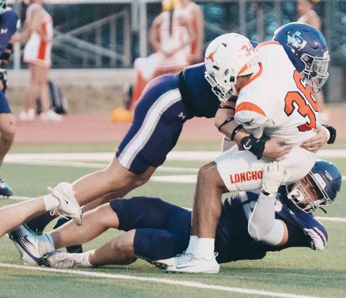 Hounds hold off Horns, 41-34