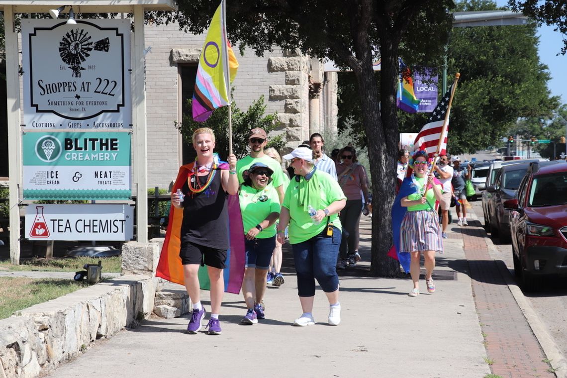 Hundreds take pride in walk down Main