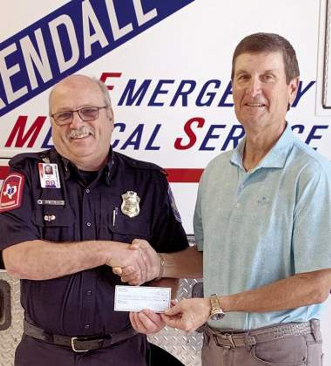 Tapatio Springs MGA presents check to Kendall County EMS