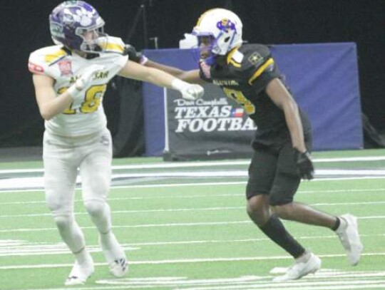 Boerne High’s Koby Hunter (left) has his jersey pulled as he goes out for a pass in Saturday’s All-Star game.