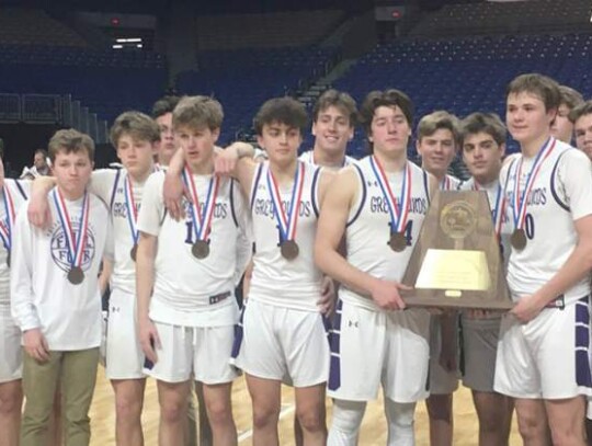 The Boerne boys basketball team with the state runner-up trophy they earned at the state tourney last weekend in the Alamodome.