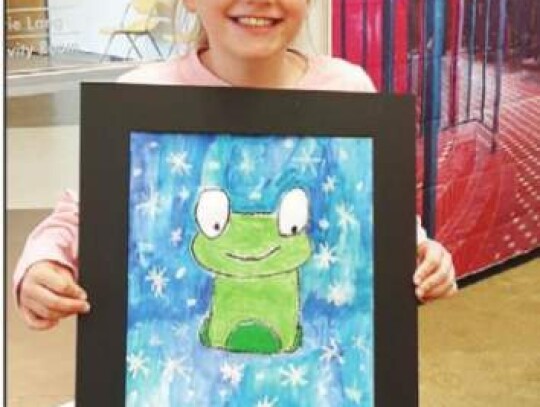 Third-grader Alexis Harrison, a student at Cibolo Creek Elementary School, shows off her artwork from the BISD Art Show. Artwork will be on display all month at the library. Submitted ph