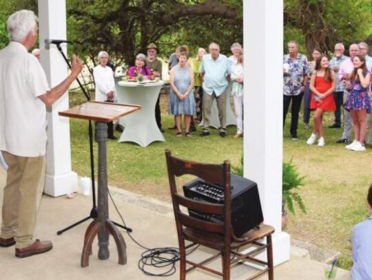 Brent Evans leads last Saturday’s Herff twins birthday celebration. Star photo by Keith E. Domke