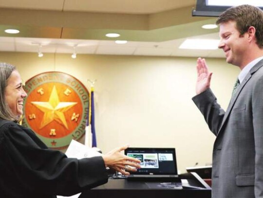 Boerne ISD Trustee Garrett Wilson took the oath of office as administered by 451st District Court Judge Kirsten Cohoon on Monday night during the school district’s May meeting. Wilson had no opponent for his Place 5 seat. Star photo by Zachary-Taylor Wright