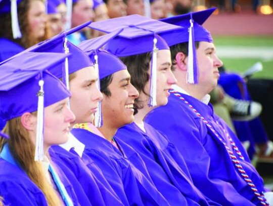 BHS graduates Ashlee Bond, Atlee Boone, Jacob Borjon, Aiden Boyd and William Bradshaw, from left, listen to one of the graduation speeches. Star photo by Keith E. Domke 