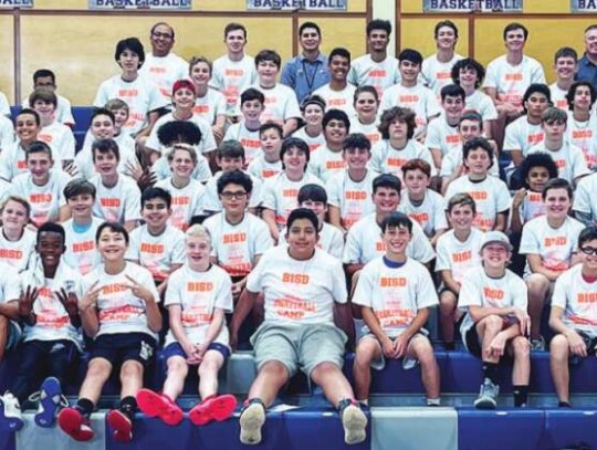 At the end of the week, attendees and coaches pose for a photo in their camp T-shirts. </br> Submitted photo