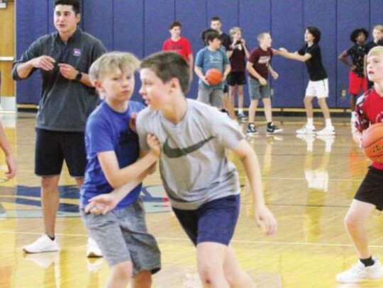 BHS assistant coach Richard Braud watches as campers play in a scrimmage game. </br> Star photo by Kerry Barboza