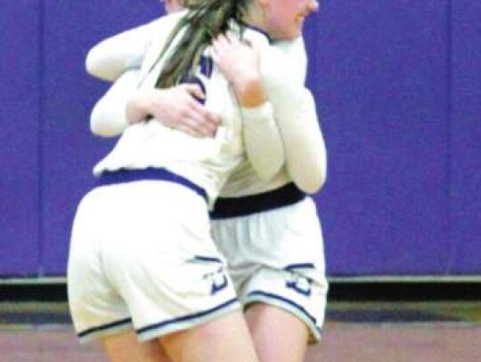 Abby Smith and Jordyn Lemm hug after a big win for the Boerne girls basketball team that was one victory away from playing in the state tournament.