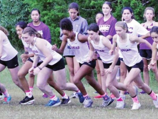 Members of the Boerne girls cross country team leave the starting line at a race in town.