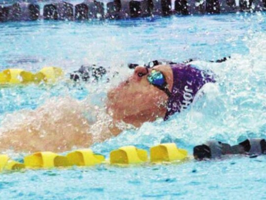 Henry Johnson swims the backstroke for the Boerne High boys at a meet during the last school year.