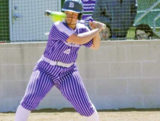 Softball player Reese Wilson lets a high pitch go by during an at bat for the Greyhounds.