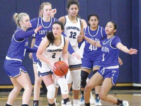 Adriana Barreiro (2) and Khiara Flugence (32) helped lead the Charger girls basketball team to the playoffs this past school year.