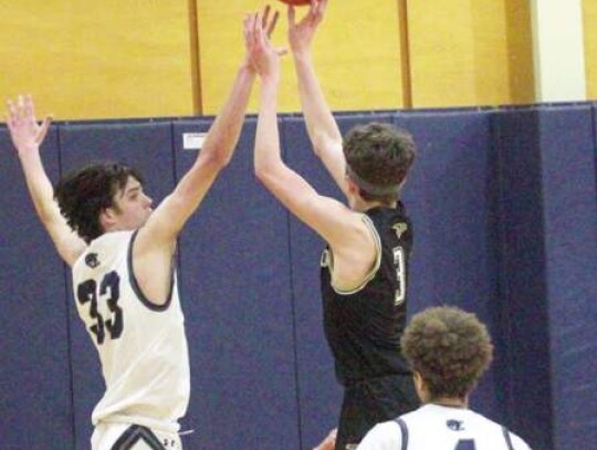 Braden Baum (33) and Jesse Peart (4) helped the Champion boys basketball team reach the state tournament for the first time in school history.