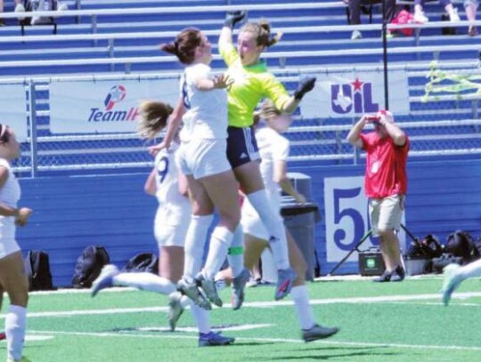 Skyleigh Arnold (8) and Audrey Riordan celebrate a goal at this year’s state soccer tournament. The girls won the region and advanced to Georgetown.