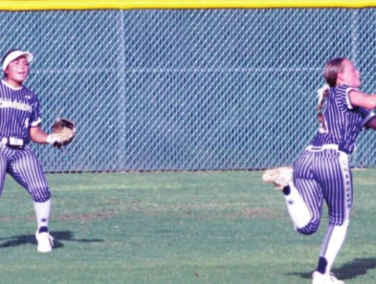 Ashley Ottmers makes a catch from second base during the Champion softball team’s playoff game vs. McCollum.