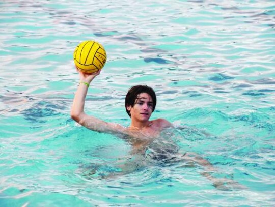 Ethan Roecker holds the ball high in the air as he participates in a drill. Champion opens its season next week with matches at Alamo Heights. </br> Star photos by Keith E. Domke