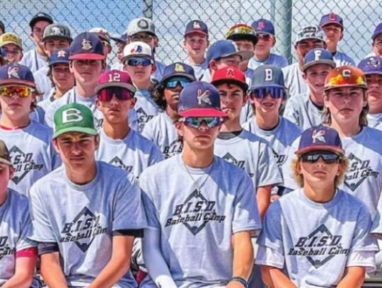 The youngsters pose for a photo in their camp T-shirts.