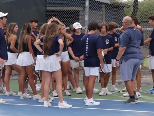 Champion tennis coach Joey Cantu talks with members of the Chargers team that played at Smithson Valley this week and earned a tough victory. </br> Star photo by Kerry Barboza