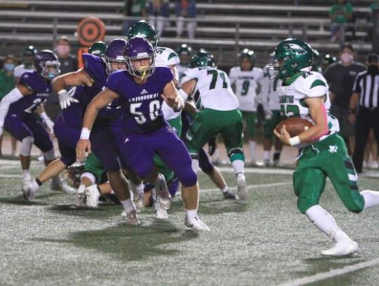 Koen Wolff (4) and Charlie Stahl zero in on a Pleasanton ball carrier and stop him short of the goal line. </br> Star photo by Russell Hawkins 