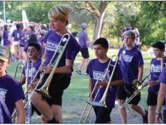 The Boerne High School Mighty Greyhound Marching Band gears up for the Boerne High Homecoming Parade Monday, marching toward its place at the front of the procession. Pictured from left to right: Spencer Langer, Roderick Donado, James Rogers, Halen Griffin and Samuel Poffenbarger.