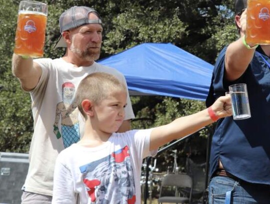 Sage Stokes joins his dad, Dwayne, in the stein holding competition where spilling beer is a cardinal sin and contestants are challenged to keep their arm straight.