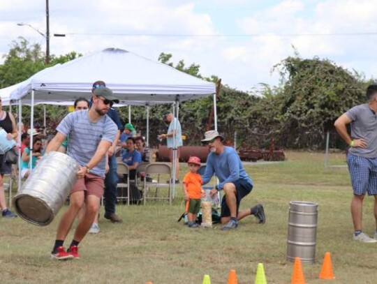  Kurtis Graves takes his first attempt at tossing a keg during Boerne BierFest at the Agricultural Museum and Arts Center Saturday. The event his hosted to help fundraise for the Hill Country Council for the Arts.