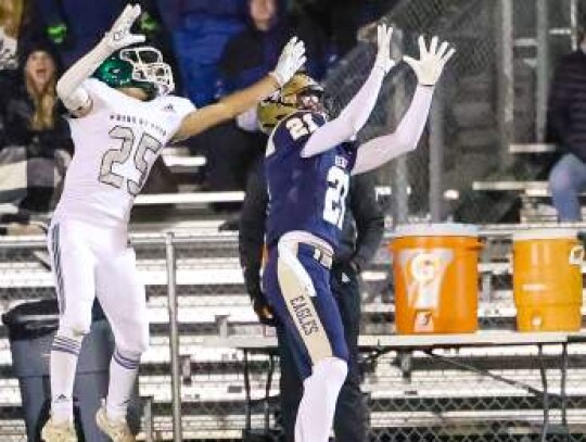 Geneva’s Luke Kaiser (21) makes a catch for the Eagles football team. Geneva played Friday in the second round of the TAPPS playoffs. 