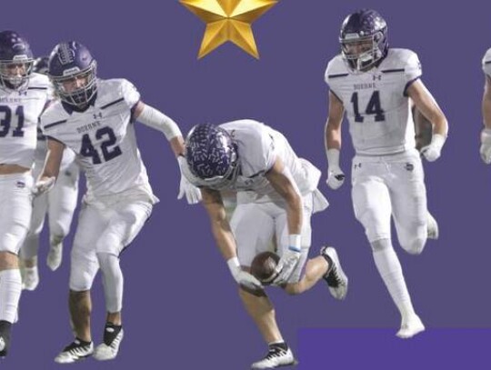 Koen Wolff, with his teammates following down the field, works on picking up a loose ball in Friday’s game at Alamo Stadium as his teammates follow him down the field. Wolff later had an interception returned for a touchdown to close the first half. Star photos by Russell Hawkins