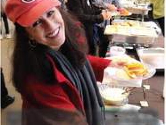 Jeanine Davis-Perron, drummer and founder of the band Gun Powder Soup, was all smiles as she took advantage of the food and drink offerings at the joint celebration Thursday.