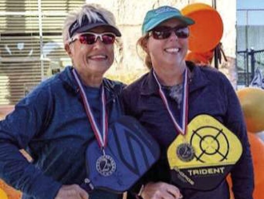 Gilda Garcia and Sherri Lowrie claimed silver in the women’s division.